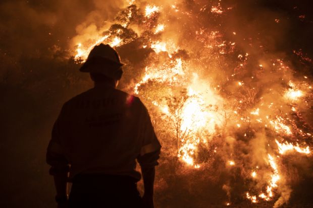 Monrovia, California USA - September 15, 2020 Firefighters work the Bobcat Wildfire in the hills above Los Angeles. Monrovia, California USA - September 15, 2020 Firefighters work the Bobcat Wildfire in the hills above Los Angeles.