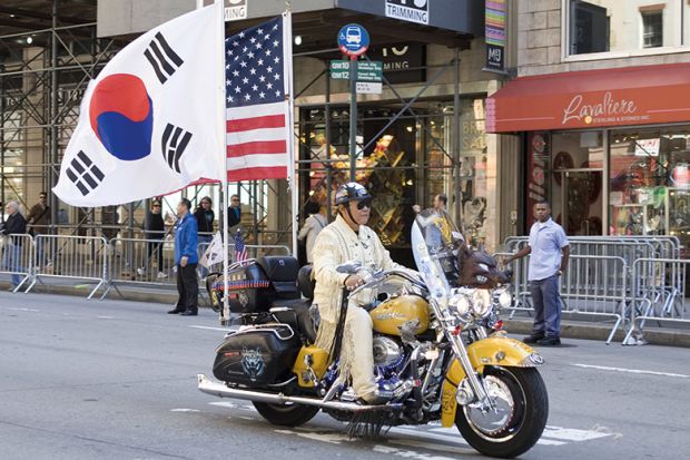 Korean Day Parade along Avenue of the Americas in New York, USA. Motorbike with American and Korean flags Korean Day Parade along Avenue of the Americas in New York, USA. Motorbike with American and Korean flags