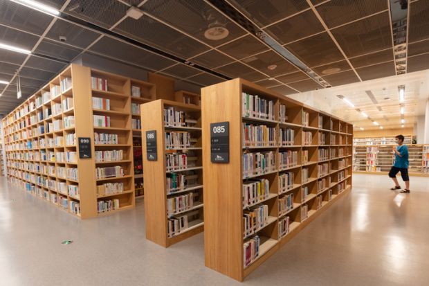 Nanchang, China - July 1, 2021 Readers read in the evening at the Jiangxi Provincial Library