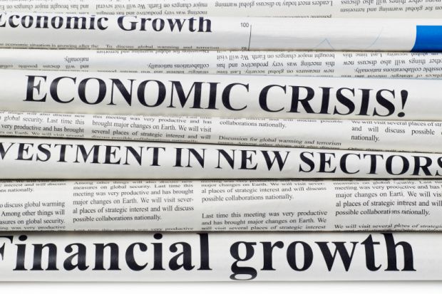 Newspaper front pages with economics headlines