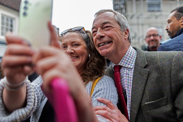 Leader of the Reform Party Nigel Farage poses for a selfie while on a walkabout on 25 April, 2025 in Beverley, England. To illustrate that universities are attempting to woo Reform.
