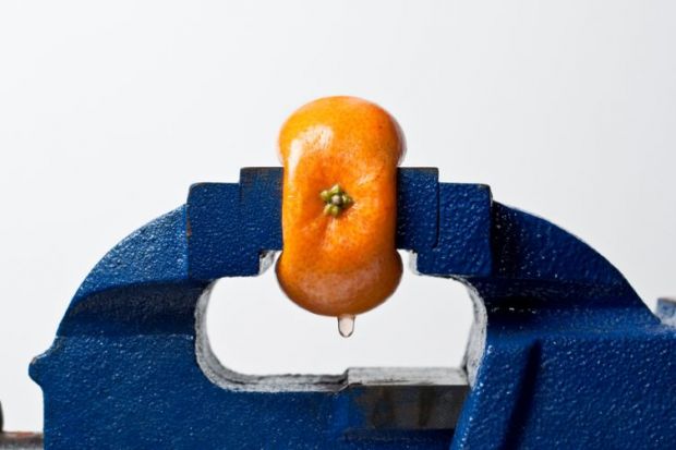 Orange squeezed in vice Orange squeezed in vice