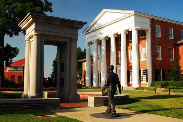 Oxford, MS, USA July 21, 2010 a statue of James Meredith, walking through an open door, honors the the first African American to attend the University of Mississippi