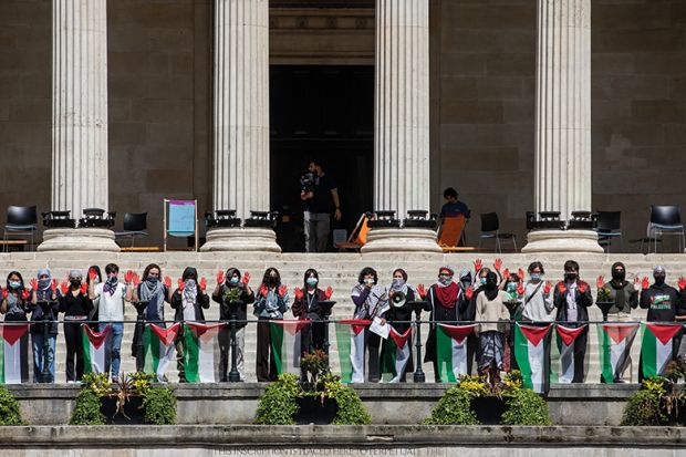 Students from UCL hold up hands painted red during a pro-Palestinian rally, 2024 Students from UCL hold up hands painted red during a pro-Palestinian rally, 2024