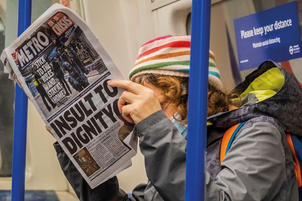 Reading paper on tube during pandemic