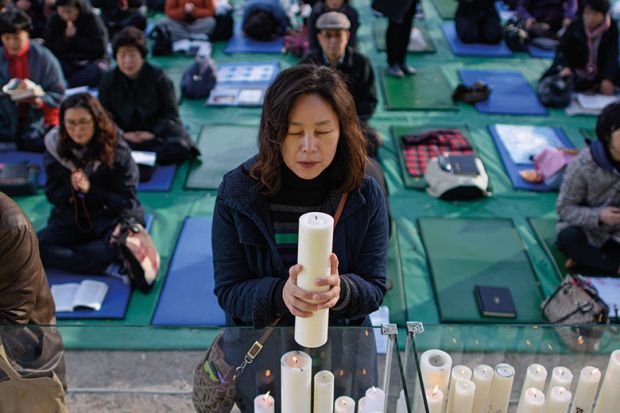 Parent prays for students sitting college entrance exams, Seoul Parent prays for students sitting college entrance exams, Seoul