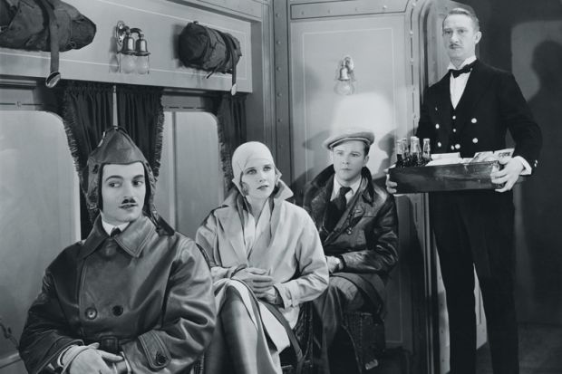 People being served in First Class train carriage People being served in First Class train carriage