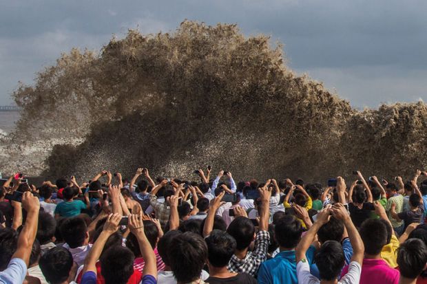People taking photos of tidal waves, Typhoon Usagi People taking photos of tidal waves, Typhoon Usagi