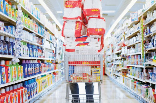 Person pushing overloaded shopping trolley