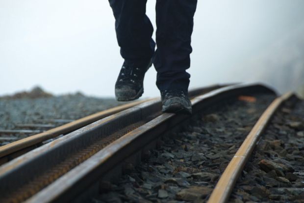 Person walking on rail tracks (detail) Person walking on rail tracks (detail)