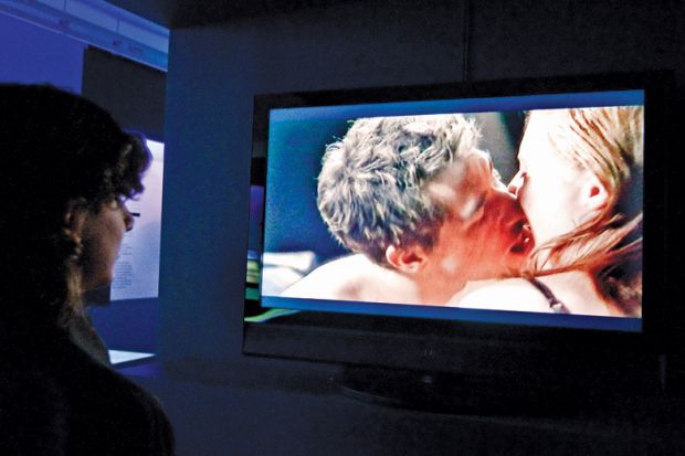 Person watching sex scene on television screen, Museum of Sex, New York City Person watching sex scene on television screen, Museum of Sex, New York City