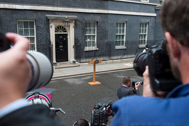 Photographers waiting for an announcement with empty lectern outside Downing Street. To illustrate that universities waiting for government intervention are likely to be disappointed. Photographers waiting for an announcement with empty lectern outside Downing Street. To illustrate that universities waiting for government intervention are likely to be disappointed.