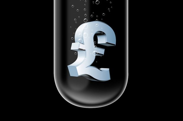 Pound (£) currency symbol sinking in test tube Pound (£) currency symbol sinking in test tube