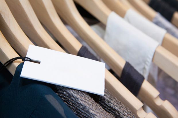 Price label on rack of designer clothes