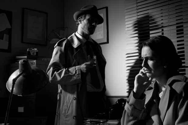 Private detective questioning woman in office Private detective questioning woman in office