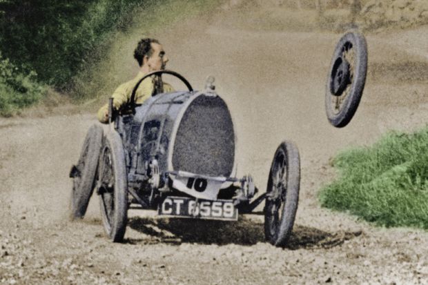 Racecar losing wheel as it turns corner Racecar losing wheel as it turns corner