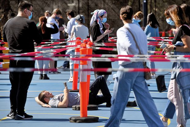 There is value in the simplicity of my open access proposal for Australia Man reading book in vaccination queue