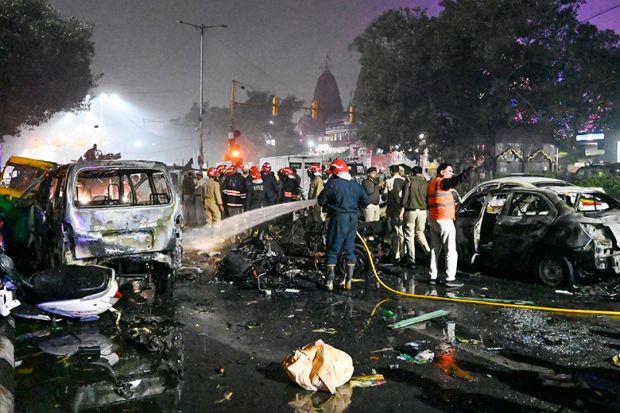 Fire Brigade personnel try to douse a fire after a blast near the Red Fort Metro Station Gate No. 1 on 10 November 2025 in New Delhi, India.