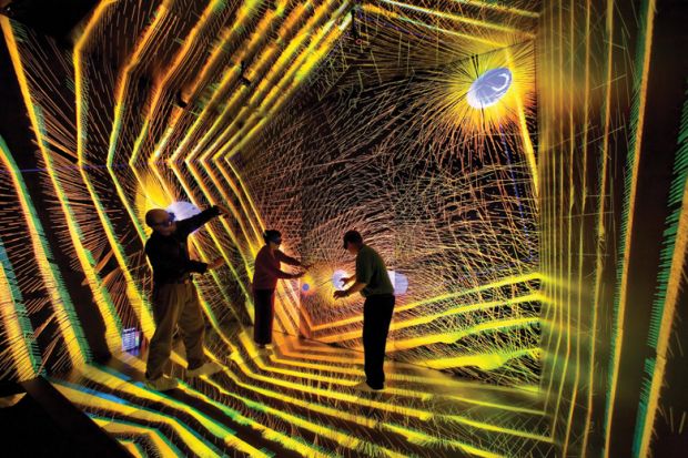 Researchers inside astronomical simulation, Los Alamos National Laboratory