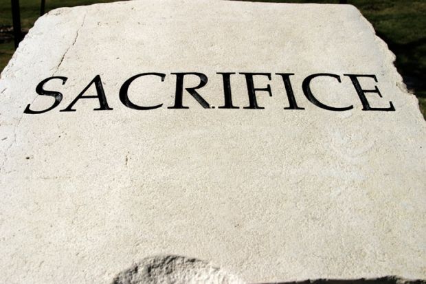 'Sacrifice' engraved on stone tablet 'Sacrifice' engraved on stone tablet