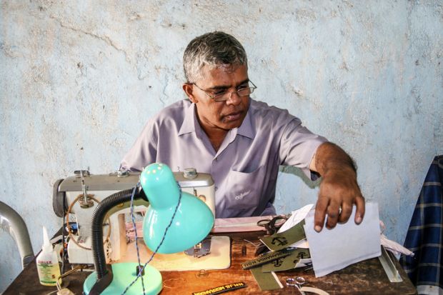 Sewing name badges for customers in Anuradhapura, Sri Lanka