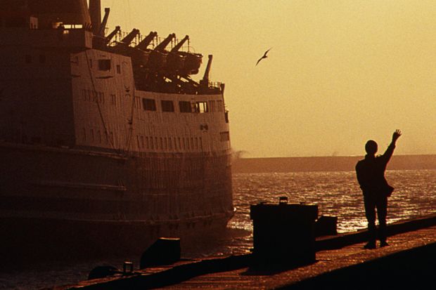 Silhouette of person waving to departing ferry, Boulogne-sur-Mer, France Silhouette of person waving to departing ferry, Boulogne-sur-Mer, France