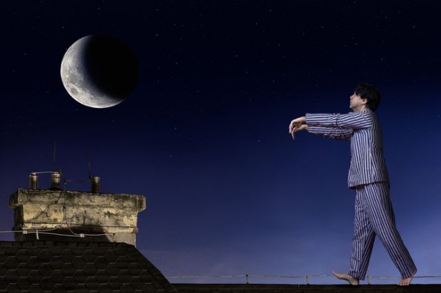 A man sleepwalking on a roof A man sleepwalking on a roof