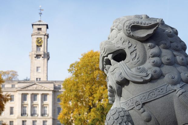 Stone lion in front of Nottingham University's Trent Building Stone lion in front of Nottingham University's Trent Building