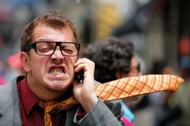 Stressed/angry man speaking on mobile phone Stressed/angry man speaking on mobile phone