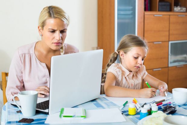 stressed-woman-with-child-working-from-home stressed-woman-with-child-working-from-home