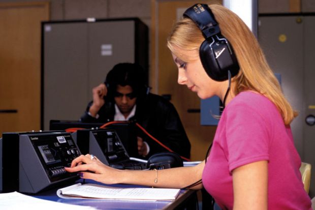 Student using college language lab Student using college language lab