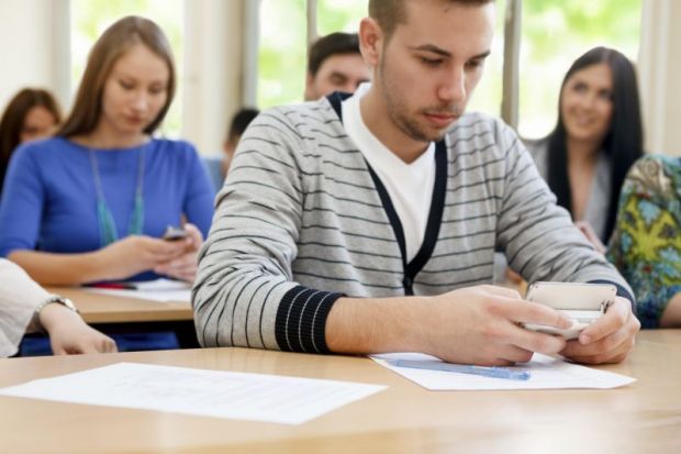 Student on phone in class Student on phone in class