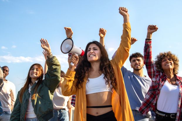 Student protestors with a megaphone Student protestors with a megaphone