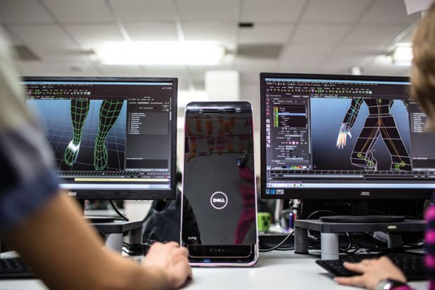 Students working with Dell desktop computers Students working with Dell desktop computers