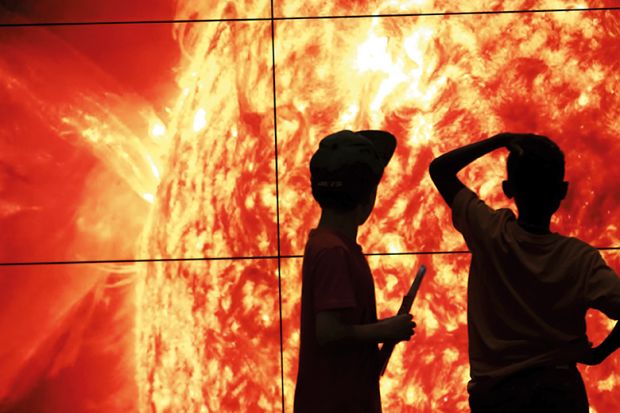 children look at the sun