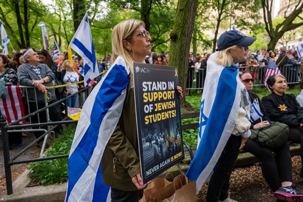 People attend a Holocaust memorial ceremony held a block away from Columbia University as protests both for and against Israel continue at area universities and colleges on 6 May, 2024 in New York City. People attend a Holocaust memorial ceremony held a block away from Columbia University as protests both for and against Israel continue at area universities and colleges on 6 May, 2024 in New York City.