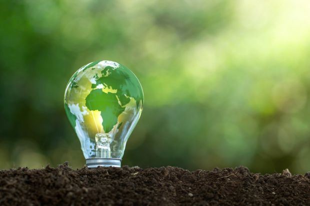 A lightbulb with a green earth on it A lightbulb with a green earth on it, symbolising sustainable development