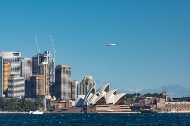 A plane flies over Sydney Opera House A plane flies over Sydney Opera House