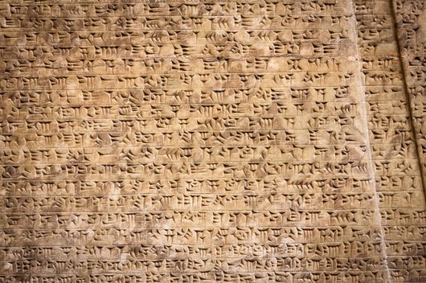 Ancient cuneiform writing illustrating an opinion article about the value and purpose of university syllabi