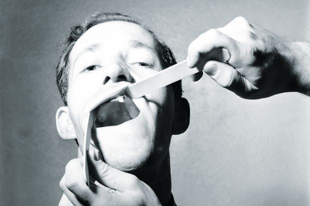 Examining teeth Examining teeth