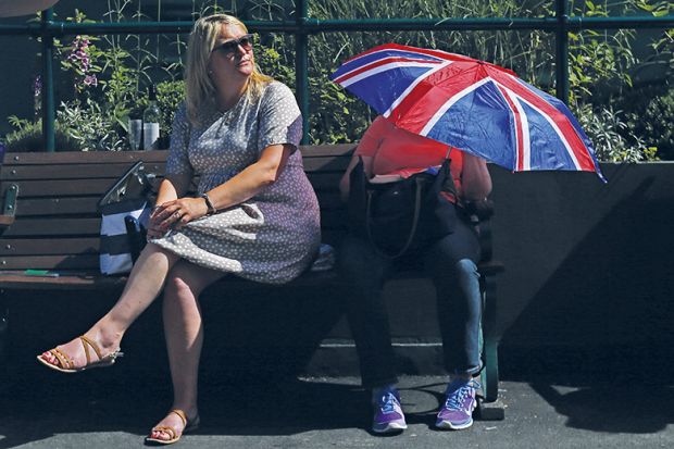 Person with Union Jack umbrella
