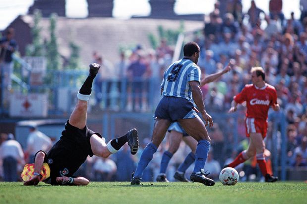 Football player falling over