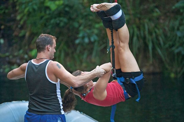 Person hanging from bungee rope