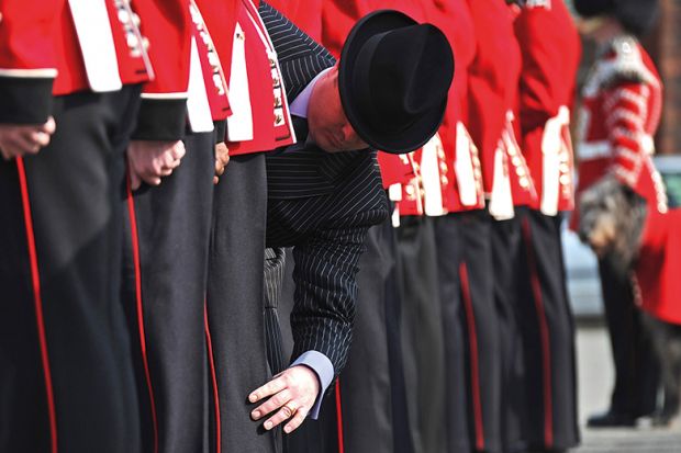 Master Taylor checks the cut of an Irish Guard's uniform