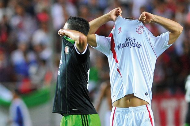 football players swapping shirt