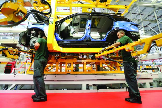 Production line employees working on Range Rover