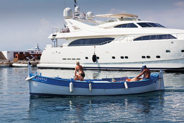 rowing boat in front of yacht.jpg
