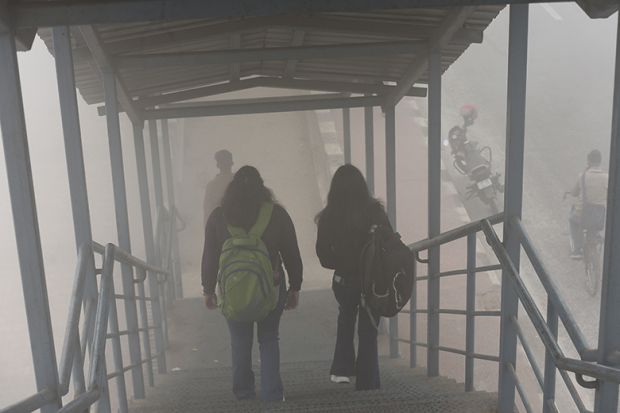 Image of students walking down stairs in the fog