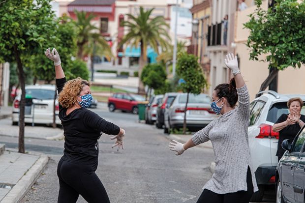 Locals wearing protective mask dance sevillana, a typical flamenco dance, in the street in front of their house April 24, 2020 in Mairena del Alcor, Spain during Covid-19 pandemic Locals wearing protective mask dance sevillana, a typical flamenco dance, in the street in front of their house April 24, 2020 in Mairena del Alcor, Spain during Covid-19 pandemic