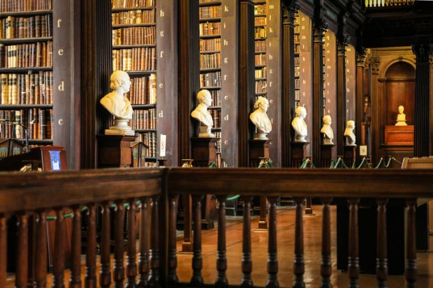 Thousands of books on shelves inside the Trinity College Library Dublin